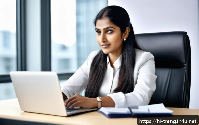 무역영어 학습법 개선과 효율적 자료 활용 - A confident Indian professional woman in business attire, sitting at a modern office desk with a lap...